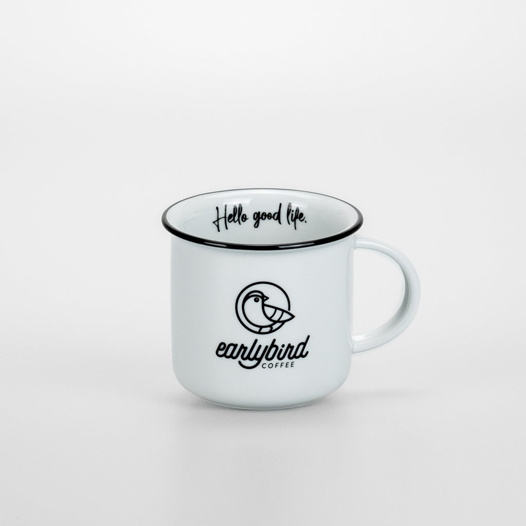 earlybird Tasse aus weißem Keramik mit schwarzem Tassenrand und earlybird coffee Logo